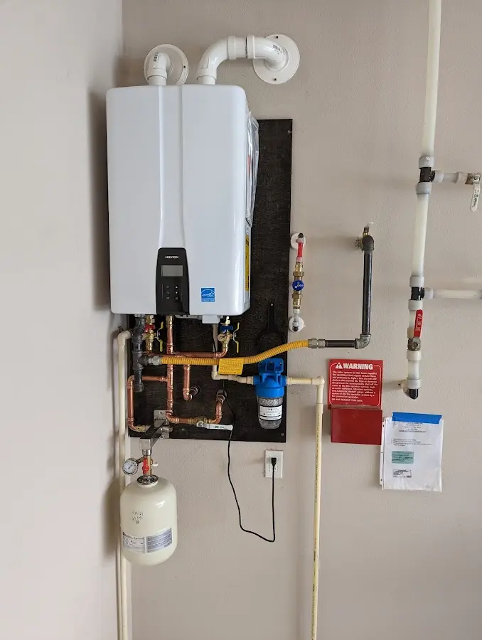 Professional plumber installing copper piping in a Fairfield home